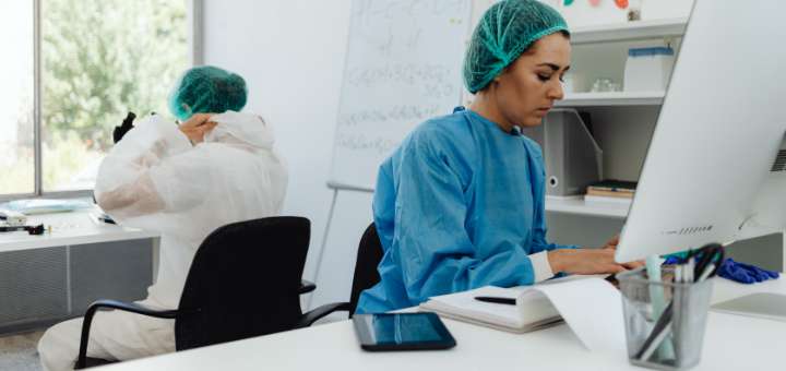 lab technician working on a computer